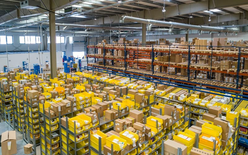 Warehouse aisles stacked with stock ready for dispatch