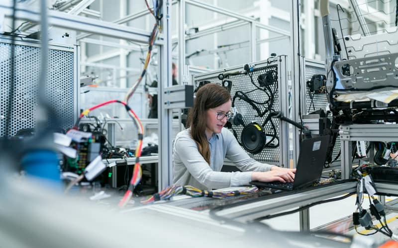 Engineer testing equipment on a workbench