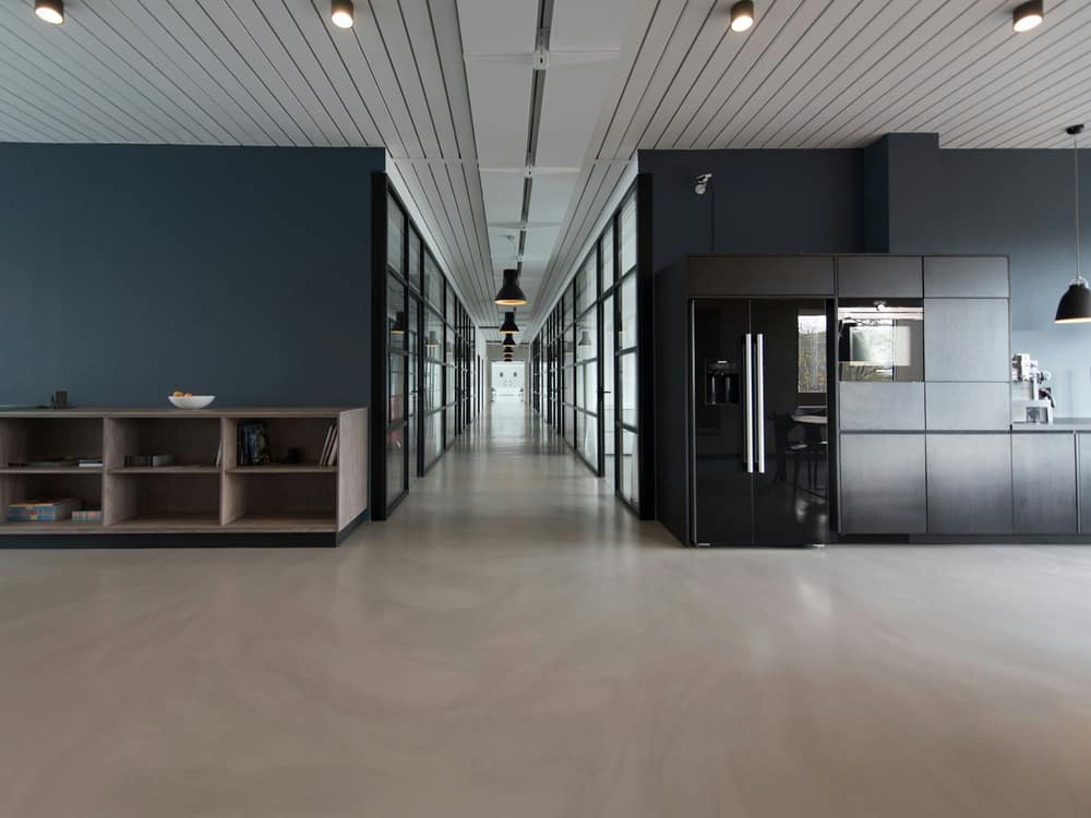 Modern open-plan office with desks and natural light